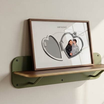 Locket Portrait of a couple Amy and Dan in a wooden frame resting on a green shelf.