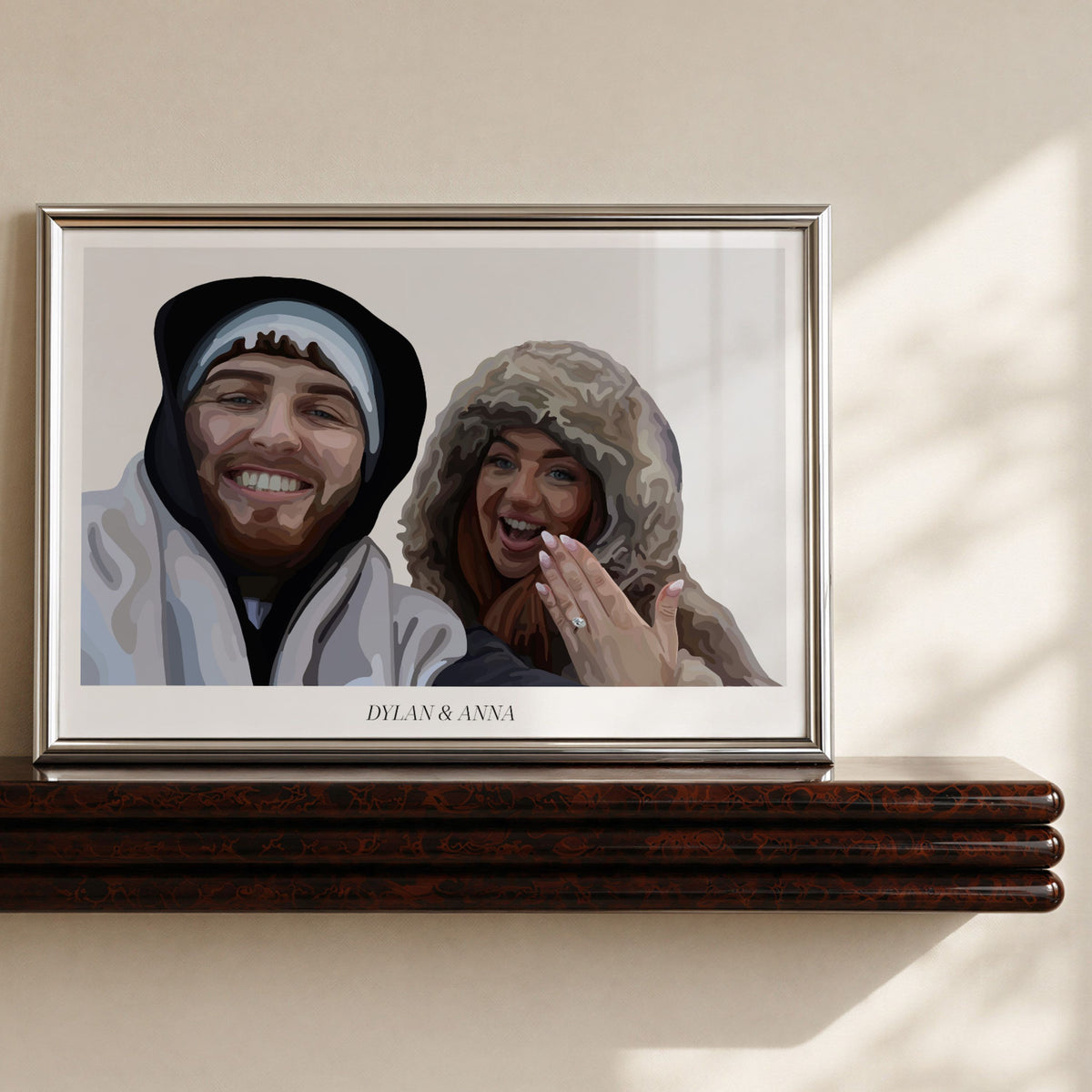 Framed print of a Bordered People Portrait showing a man and woman smiling, while the woman holds up her hand showing off an engagement ring.