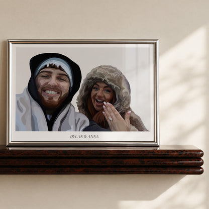 Framed print of a Bordered People Portrait showing a man and woman smiling, while the woman holds up her hand showing off an engagement ring.