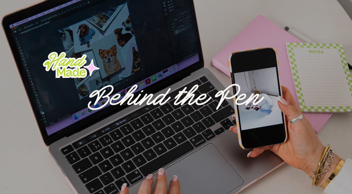 A person's hands holding a smartphone next to a laptop on a desk, with a pink notebook and a notepad. Large text overlays read 'Hand Made' and 'Behind the Pen'.