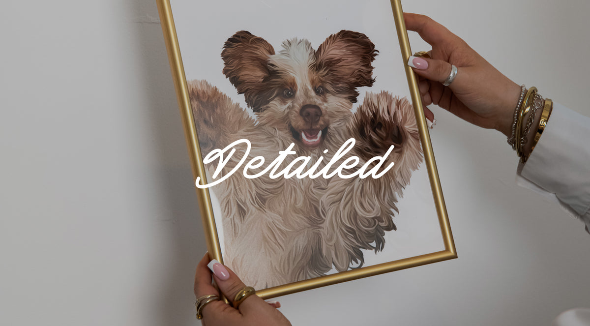 Someone holding a Detailed Pet Portrait of a fluffy dog upside down with its paws in the air. The print is in a gold frame against a white wall.