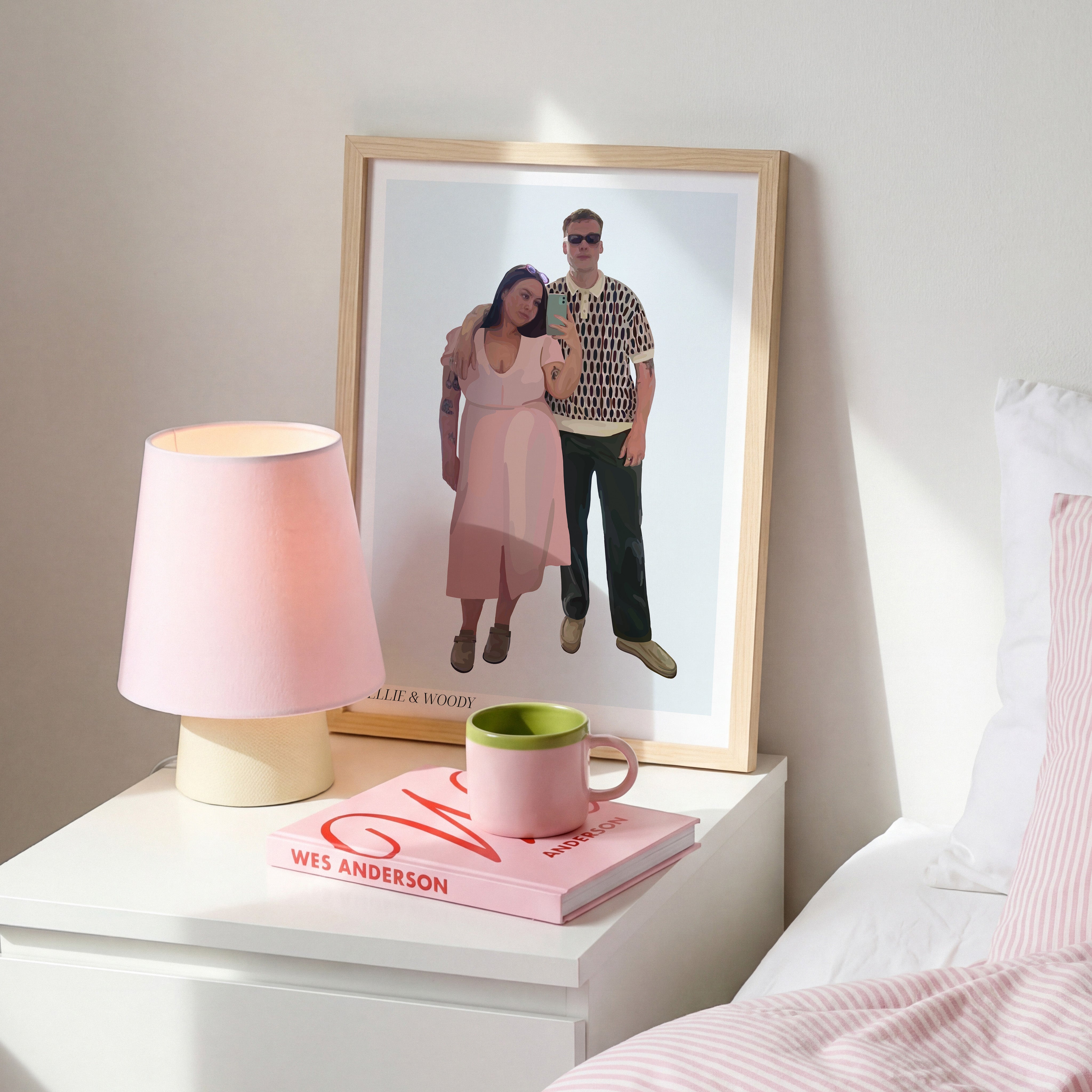 Framed Bordered People Portrait of a couple on a bedside cabinet with a lamp, book, and mug.