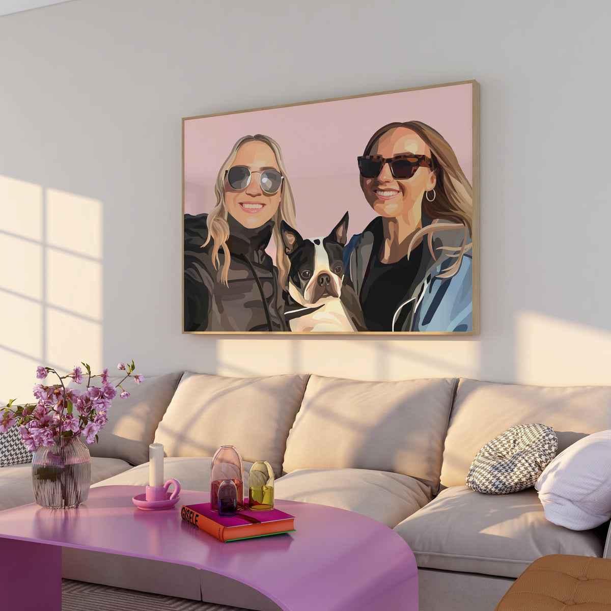 Living room with a pink coffee table, floral arrangement, and a framed People Portrait of two people and a dog on the wall.