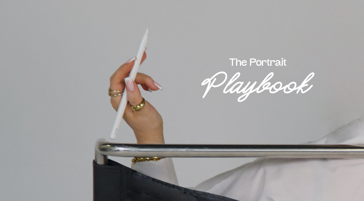 A hand holding a white stylus above a black chair, with the text 'The Portrait Playbook' on a light gray background.